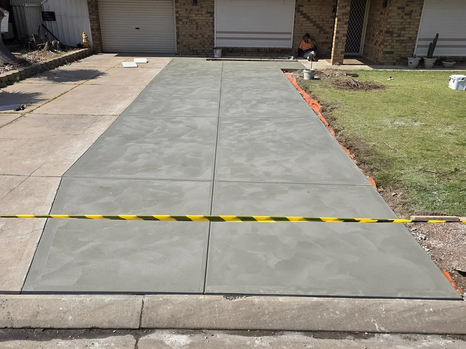 New concrete driveway with saw-cut joints completed by A and J Contractors in North Haven