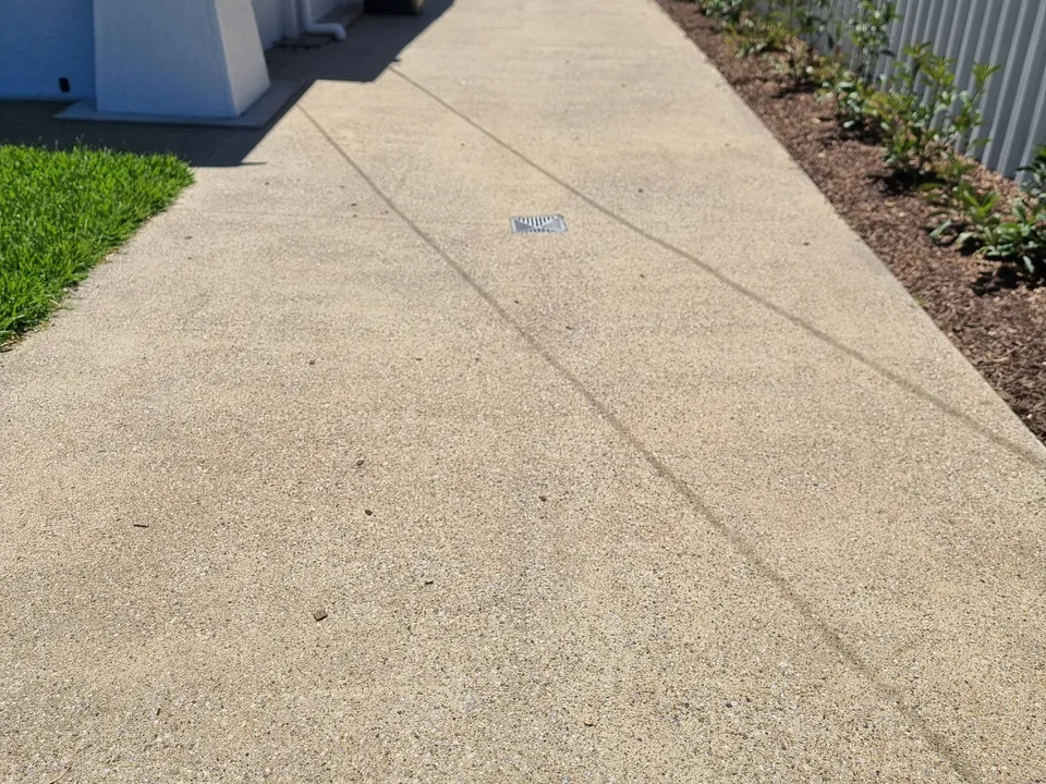 Exposed aggregate concrete driveway completed by A and J Contractors in Richmond