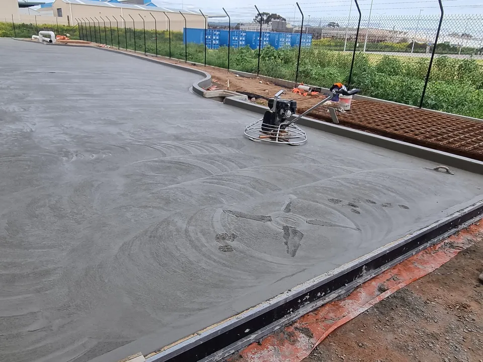 Concrete roadway and kerb poured by A and J Contractors at an industrial site in Wingfield